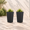 Two black ribbed polyethylene planters, each 28.3 inches high with greenery in an outdoor setting.