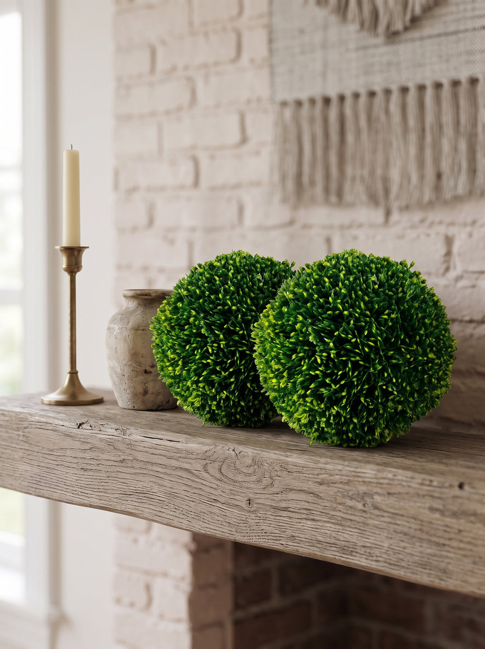 Artificial boxwood balls styled in an outdoor space