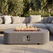 Modern gray stone look fire pit outdoor patio scene